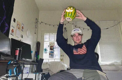 Ryan Skees holding up watermelon pumpkin